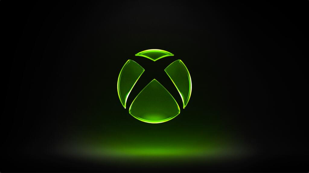 Logo verde Xbox illuminato su sfondo nero, immagine ufficiale Xbox Wire
