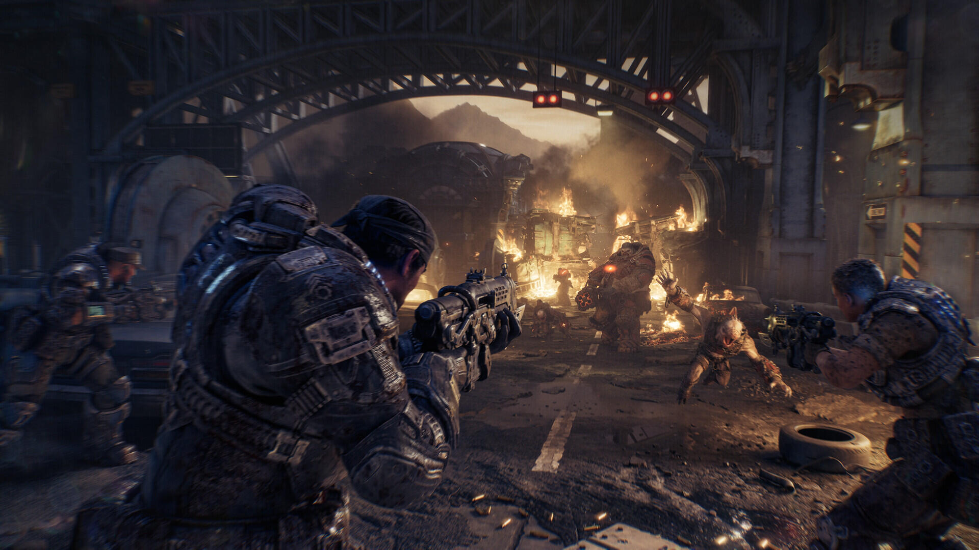 Screenshot di gameplay in-engine di Gears of War: E-Day con Marcus Fenix e la squadra in copertura che ingaggiano un Boomer e i Wretch.